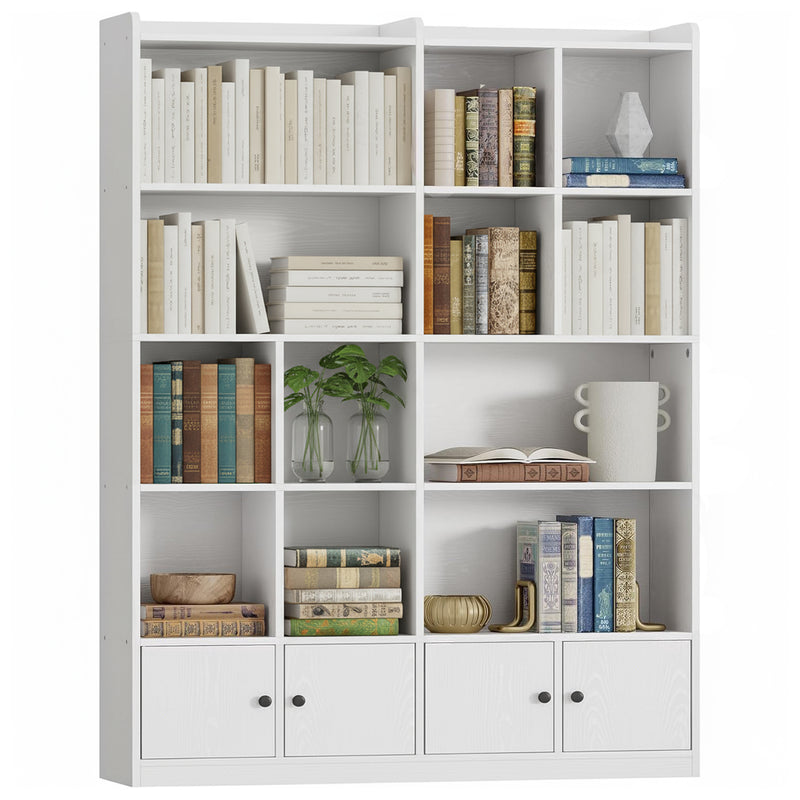 White modular bookshelf with many open cubbies filled with books and decor; bottom drawers visible.