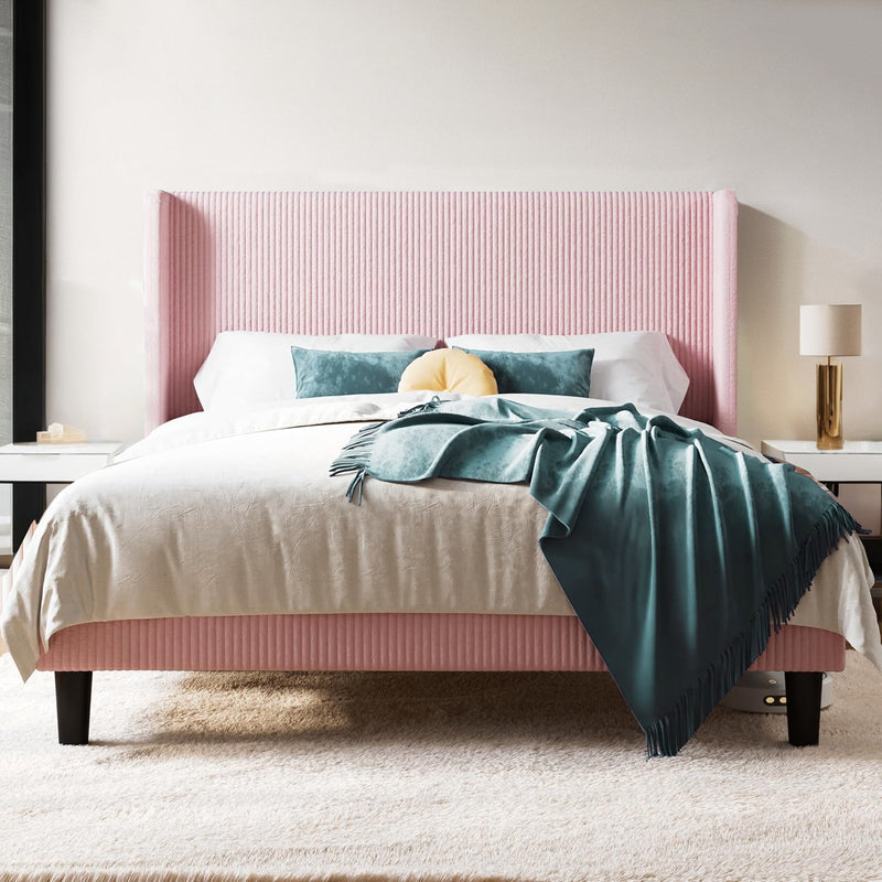 Queen-size bed with corduroy headboard and side tables; blue accent decor.